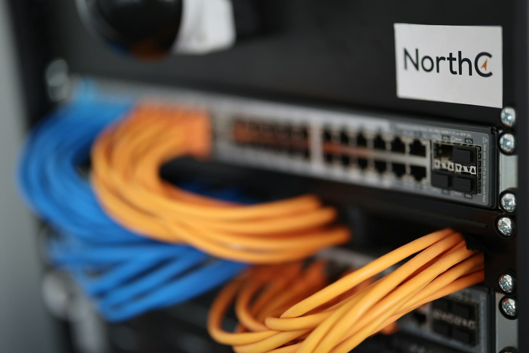 Network switch with patched cables in a server cabinet